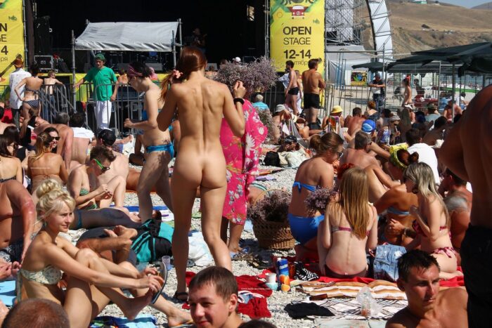 Really shameless teen Jana A walks naked at public beach