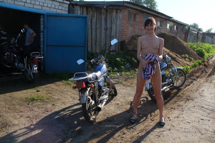 Shemeless Diana A posing on motorcycle