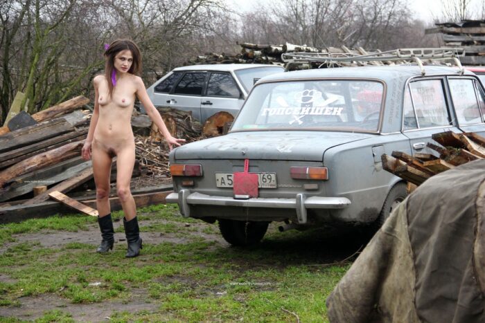 Skinny Nadeshda N with hairy pussy posing at car