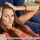 Stella Flex sultrily slips off her coral dress while chilling out on the couch. She stretches her sexy body and show off her kitty.