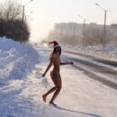 Tattoed Marina G posing naked on snowy street