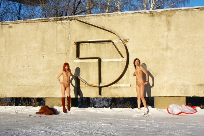 Two naked girls at the entrance to the city