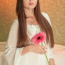 With her warm, vibrant smile coupled by her   explicit and soft erotic poses on top of the   bed reflects her elegant allure and   confident personality as she strips her   flowing white nightwear in front of the   camera.