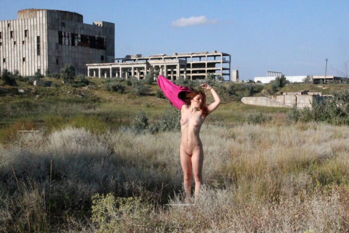Young redhead Renara at Crimean nuclear power plant