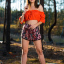 Zelda B takes off her ruffled crop top in the woods and lay down on the picnic blanket and showcase her slender body with juicy melons and hairless pussy.