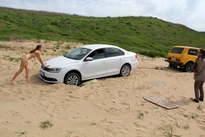Lovely Karina with hot ass helps to push the car out of the sand