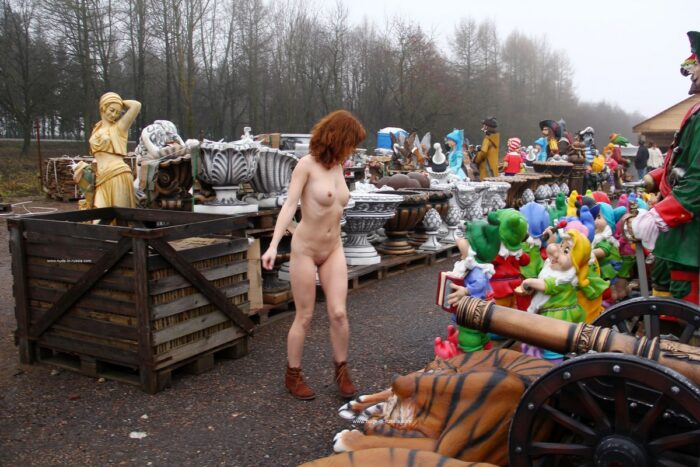 Naked redhead Masha with hot body at garden figurines market