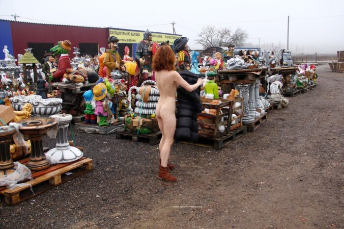 Naked redhead Masha with hot body at garden figurines market
