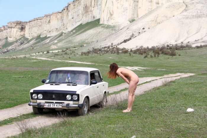 Naked russian girl Jana A gets a car near the mountain