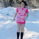 Russian brunette Klara plays with a snow at forest