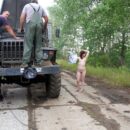 Russian girl Inga undresses in front of the mechanics