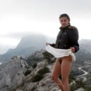 Russian teen Nasiba Z shows her very hairy pussy on the rocks