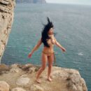 Sexy brunette Sveta O posing on very windy rocks