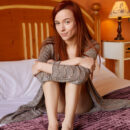 Stunning red haired Sherice disrobe her self on the bed and uncover her Slim sexy body and manicured coochie.