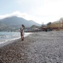 Teen brunette Nasiba Z on the beach