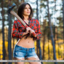 Zelda B, just finished taking down trees. She poses holding her ax and decides to take off her clothes and reveal her sizzling hot abs and curves on the right places.