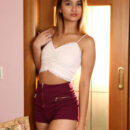 Beautiful Chelsea Star takes off her crop top and shorts, then lazes on the floral couch.