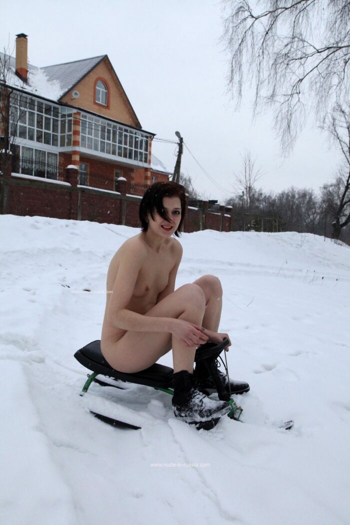 Girl Lia A riding a snow scooter and show her pussy