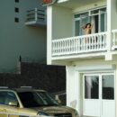 Long-haired brunette Sveta O on the balcony