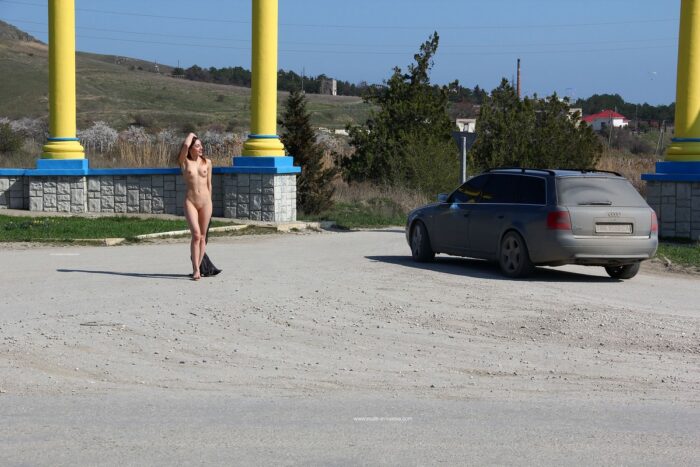 Sweet teen Jana A poses naked on the highway