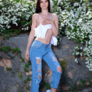 Aleksandrina takes off her crop top and tattered jeans and flashes her smooth pussy and slender sexy body.