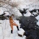 Busty blonde Varvara at winter river
