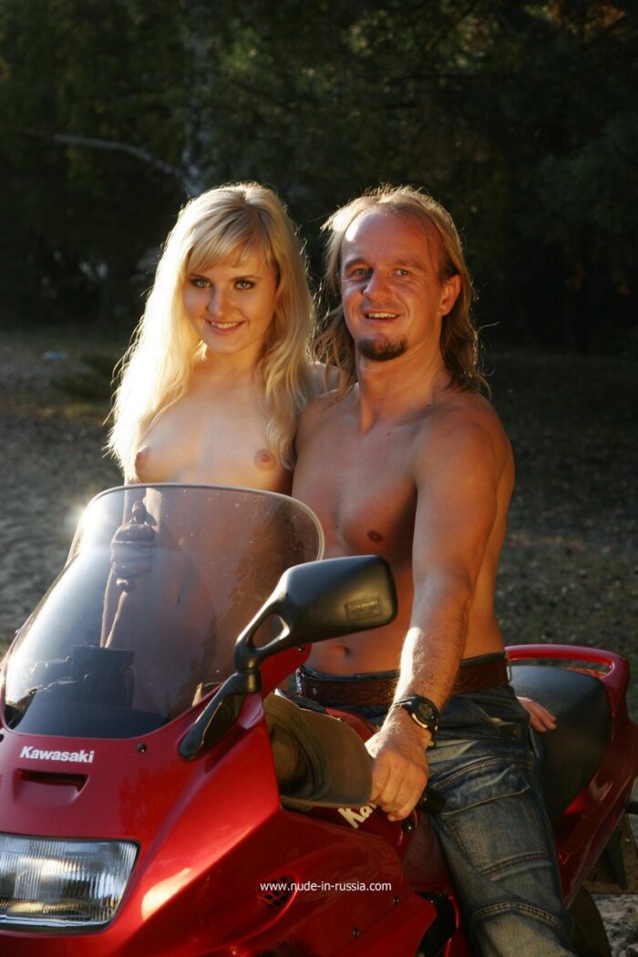 Hot russian blonde Laima posing on red motorcycle