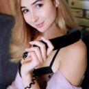 Margaret Clay makes a seductive phone call in her sexy black lingerie. She moves her undies to the side and expose her shaved coochie and her buns, waiting to be spanked.