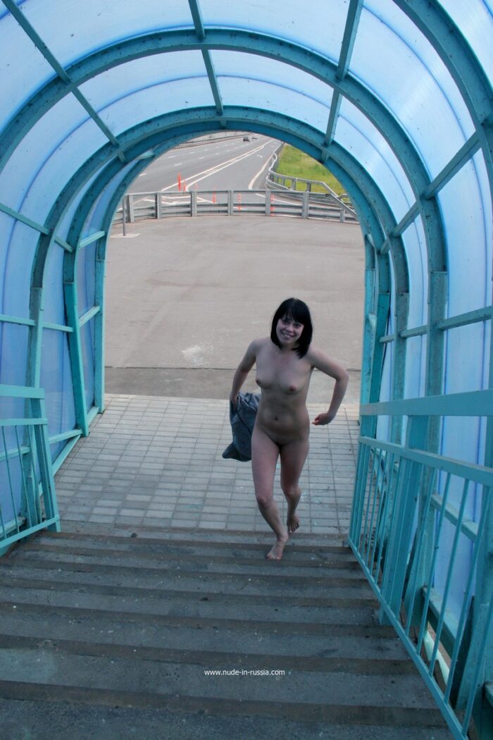 Girl Inna Z without clothes in an overground pedestrian crossing