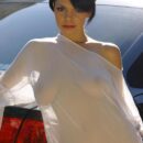 Short-haired brunette Vika S exposes her body in black Audi