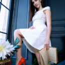 Velana looks so chic in her white dress and red pumps. She undresses, flaunts her huge knockers and sits on the velvet chair then lifts her legs up to give an open view of her smooth pinkish punani.