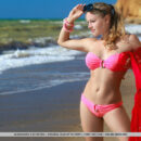 A curvy and athletic new girl flaunts her gorgeous body in stunning flexible poses in a rugged beach coast.