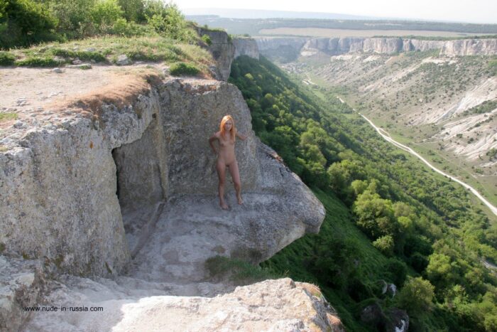 Absolutely naked Margarita S posing at tourist spot
