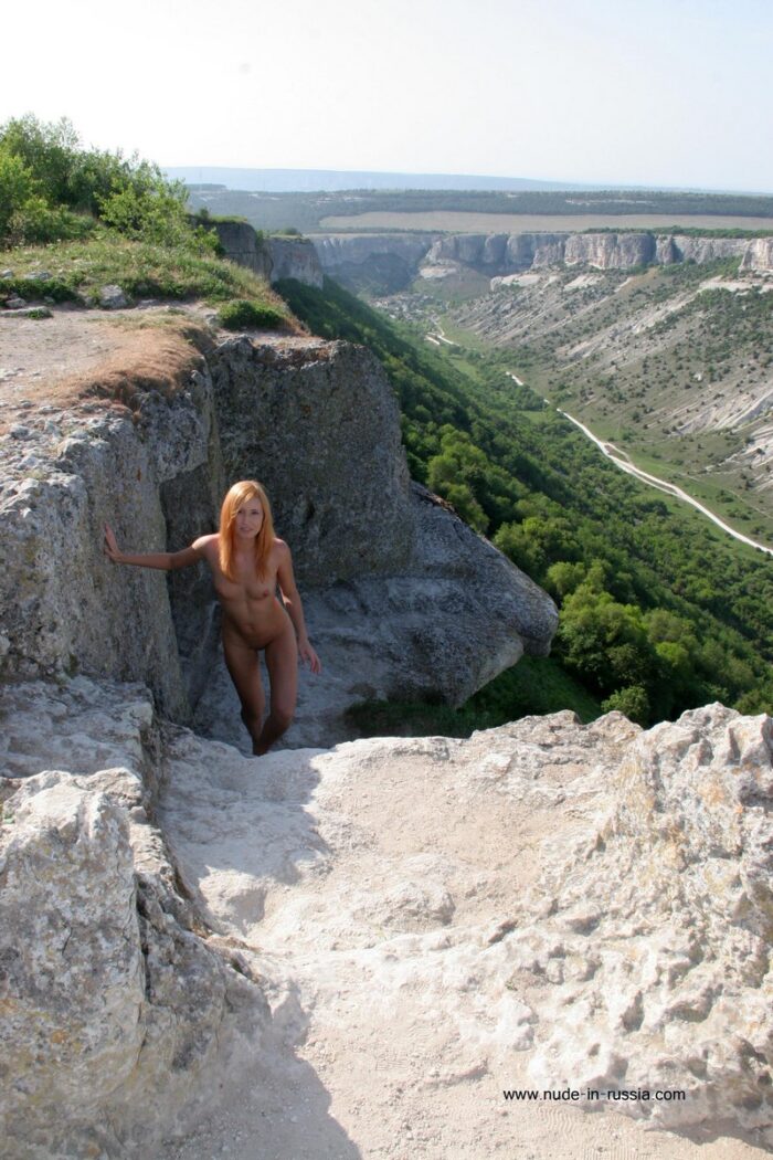 Absolutely naked Margarita S posing at tourist spot