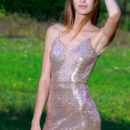 Aileen is outdoors in her glittery figure hugging long gown. She lets it slip down her bumtatsic body and show off her hairless pussy and perky knockers underneath.