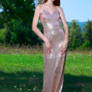 Aileen is outdoors in her glittery figure hugging long gown. She lets it slip down her bumtatsic body and show off her hairless pussy and perky knockers underneath.