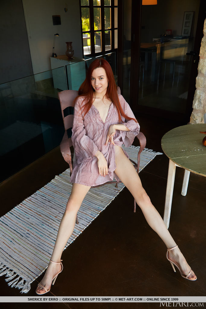 Beautiful red haired Sherice strip naked on the chair and uncover her petite sexy figure and hairless pussy.