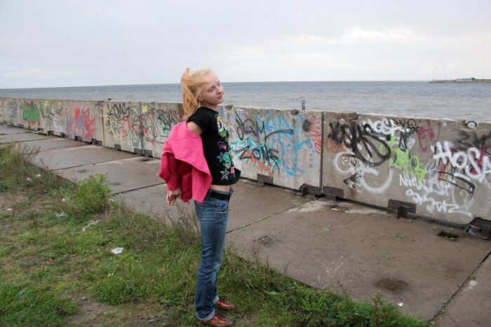 Blonde Vasilisa with small tits on an abandoned embankment