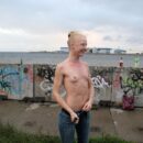 Blonde Vasilisa with small tits on an abandoned embankment