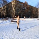 Naked russian girl Elisaveta on a snowy playground