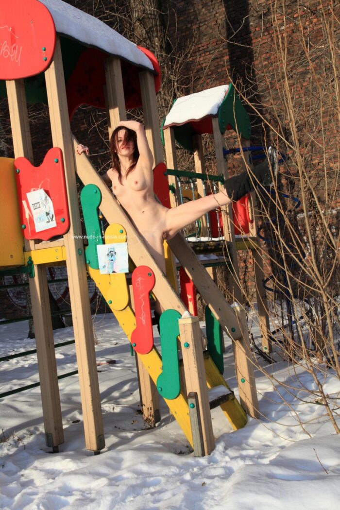 Naked russian girl Elisaveta on a snowy playground
