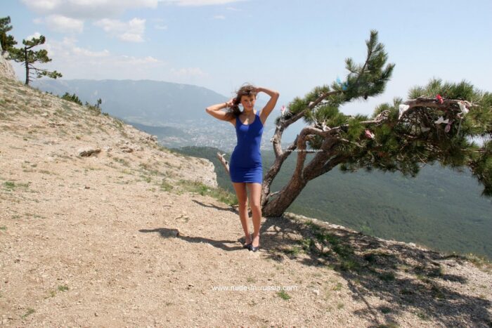 Naked teen Masha E on top of the mountain