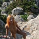 Russsian babe Margarita S walks without clothes at rocky places
