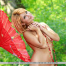 Violla evokes a striking feminine radiance and elegant composure as she delivers some relaxed yet fun poses outdoors.