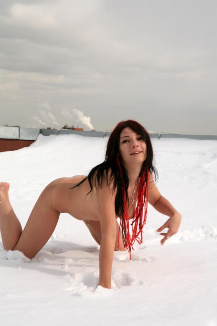 Young piercied brunette Elizaveta M shows her pussy on snowy roof