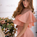 Mary Rock alluringly lifts the hem of her dress and gives a peep of her bubble butt and hairless coochie and shows off her skills on the grand piano.