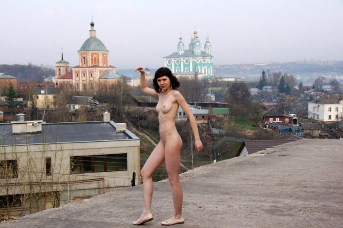 Tall brunette Ekaterina S posing naked outdoors