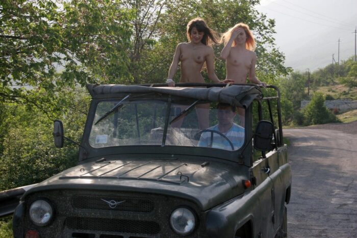 Two naked girls Margarita S and Masha E posing in moving russian jeep