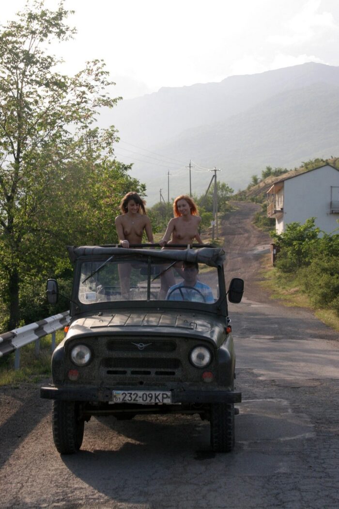 Two naked girls Margarita S and Masha E posing in moving russian jeep