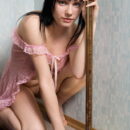 Anna AC strips her sexy night dress and showcases her slim and slender body on a leather sofa.